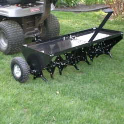 Yard Tuff 48 Inch Steel Tow Behind Plug Aerator With Pneumatic Tires, 32 Coring Plugs, And Universal Hitch For Lawn Mowers, Garden Tractors, And ATVs